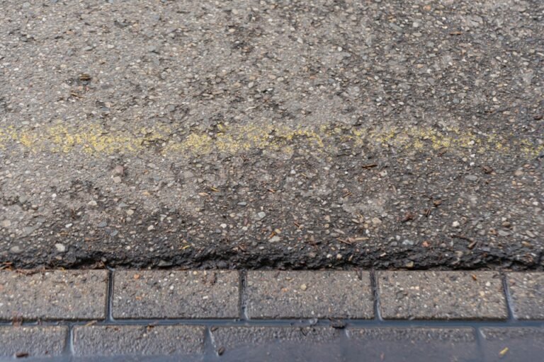 What Causes An Asphalt Driveway To Develop Cracks & Low Spots? Asphalt Driveway To Develop Cracks